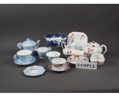 A Royal Paragon part teaset with blue floral decoration on a blue ground, a Royal Tuscan part teaset, a Royal Copenhagen pin 