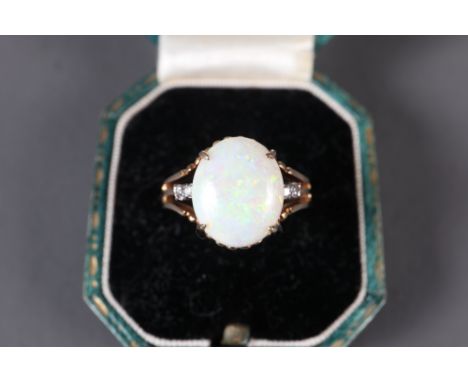 A 14ct gold diamond and opal dress ring, size K/L, 3.5g