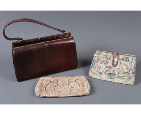 A lizard skin handbag, a Chinese embroidered clutch bag and a pearl mounted clutch bag