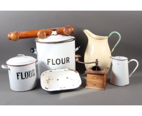 An enamelled flour bin, another similar smaller, two similar jugs, a coffee bean grinder, a bamboo effect coat hanger and oth
