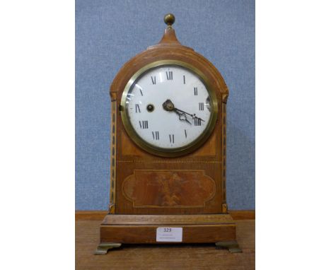 A 19th Century inlaid mahogany fusee mantel clock, the brass back plate signed Ham. Nicholls, Canterbury 