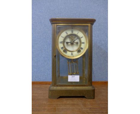A 19th Century brass and four glass mantel clock 