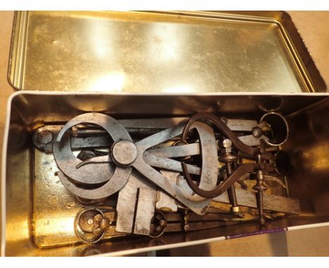 Box of steel calipers micrometers and other small engineering tools