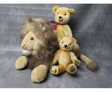 A VINTAGE MERRYTHOUGHT PYJAMA CASE IN THE FORM OF A LION, L 50 cm - not including tail, together with a smaller Merrythought 