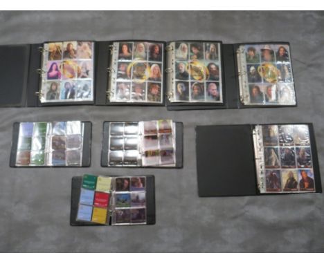 FIVE LORD OF THE RINGS TOPPS TRADING CARD BINDERS AND CONTENTS, together with three Lord of The Rings 'The Two Towers' Action