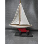 A VINTAGE POND YACHT AND STAND