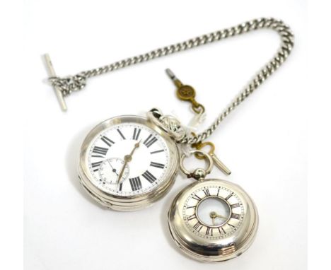 A silver open faced pocket watch with a silver curb link chain and a silver half hunter pocket watch