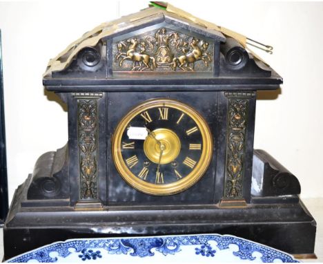 A gilt metal mounted slate striking mantel clock of architectural form