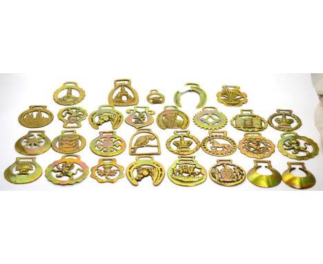 An interesting collection of vintage horse brasses including Jamica Inn, Uncle Tom Cobley and all The Lizard etc 