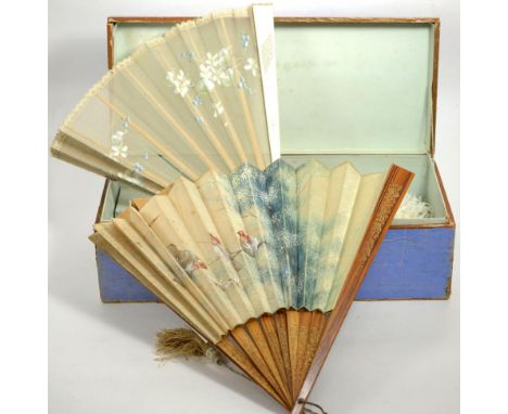 White ostrich feather fan with mother of pearl guards, four other fans with painted mounts, in a blue card fan box