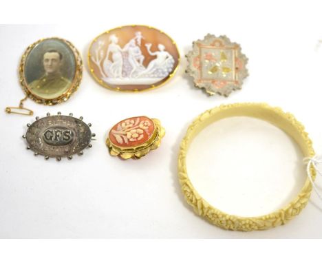 Two cameo brooches, a portrait brooch, two Victorian silver brooches and an ivorine bangle