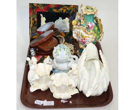 A continental cupboard dish modelled as a cat playing with ball, together with a pair of Copeland China figural vases (a.f) a