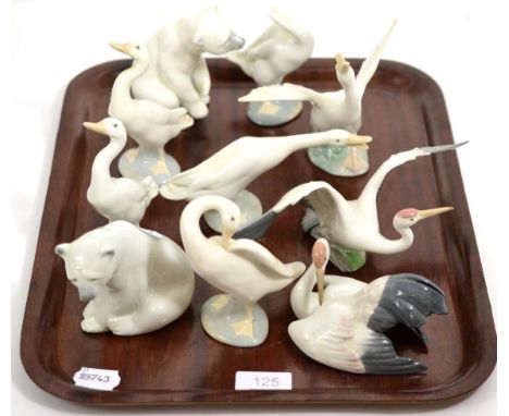 Two Lladro polar bear figures and eight Lladro geese 