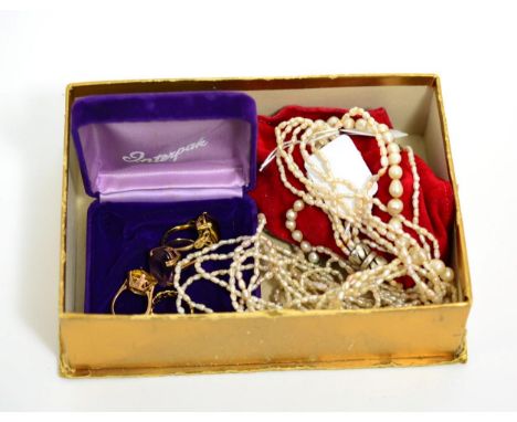 Four rings and three pearl necklacesOne marked 10KT- finger size L, 4.17g gross. Two unmarked - finger size J, 6.72g gross, f