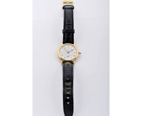 A wristwatch, 750/1000 gold case No. 3246, leather strap with gold clasp, mechanical winding movement nº 1665 with cal. 818/4