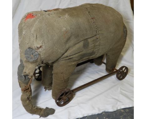 CHILDS RIDE ON ELEPHANT TOY (THREADBARE) TO METAL 4 WHEEL BASE 16' X 17' (POSSIBLY STEIFF)   