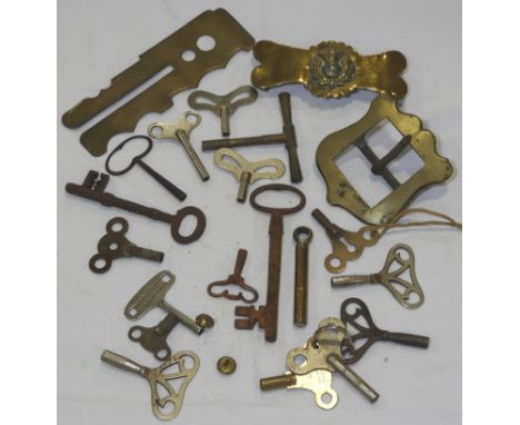 QUANTITY OF CLOCK KEYS, BRASS BELT BUCKLES, BUTTON STICK ETC   