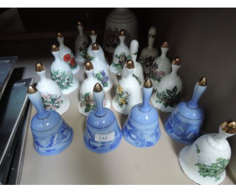 A collection of ornamental ceramic bells and whisky bell 