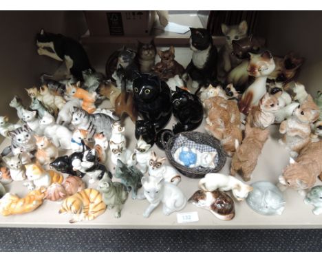 A shelf of cat orniments