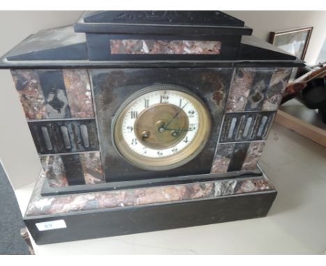 A late Victorian black slate and rouge marble mantel clock of architectural design