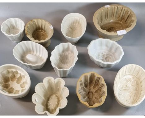Collection of ceramic jelly and other moulds, varying designs including: pineapple, flowers etc.  (11)  (B.P. 21% + VAT) 