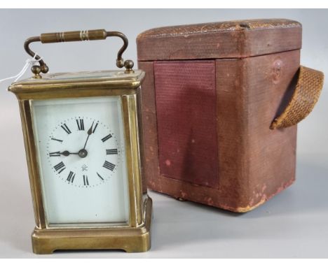 French brass carriage clock with full depth Roman ceramic face together with appearing original leather carrying case. 11.5cm