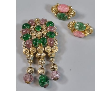 Christian Dior, gilt metal brooch with green and pink coloured stones and a pair of matching clip on earrings appearing in or
