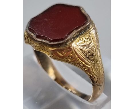 9ct gold shield shaped carnelian seal ring. 4.7g approx. size Q1/2. (B.P. 21% + VAT)  Appears to be no obvious damage or repa