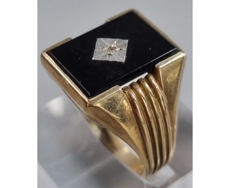 9ct gold black onyx signet ring with tiny diamond chip.  5.4g approx.  Size S.  (B.P. 21% + VAT) 