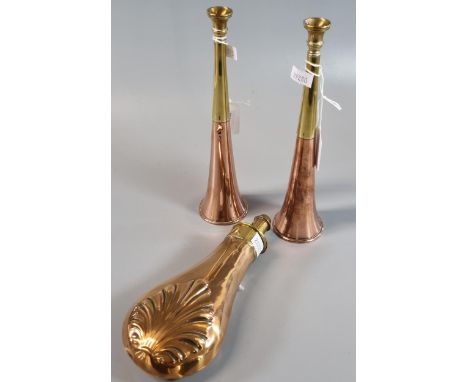 Pair of copper and brass hunting horns, together with a copper and brass powder flask with relief shell decoration.  (3)  (B.