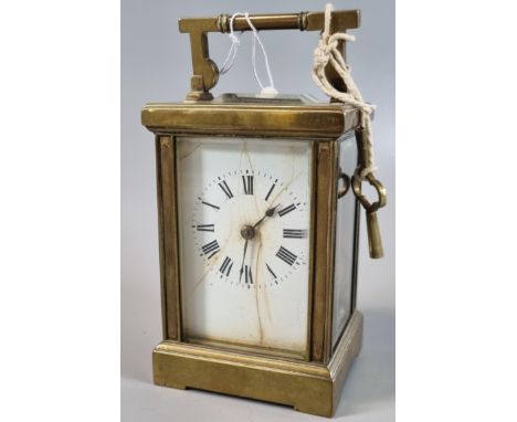 French brass carriage clock with full depth Roman ceramic face and two train movement striking on one gong.  13cm high approx