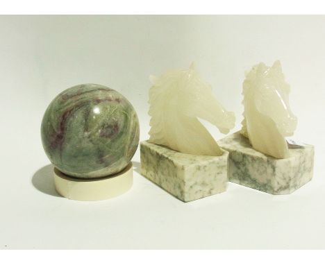 Two book ends with horse's heads, fluorite ball, soapstone chess pieces and a Mrs Beeton's cookbook 