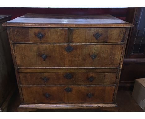 Early 18th century walnut chest with circular pattern stringing and thumb moulded edge having two short and three long drawer