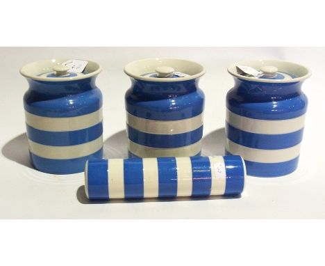 T&G Green Cornishware three storage canisters, 18cm tall and a rolling pin lacking its handles (4)  