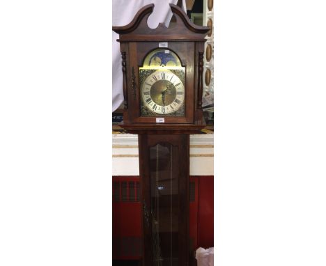 Mahogany cased grandmother clock with brass and silvered dial, striking movement, glazed trunk door, raised on a box base, by