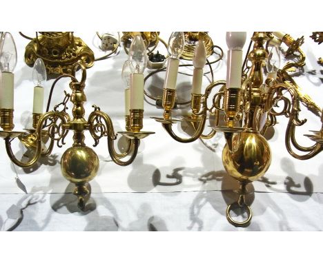 Two bulbous wall lights with two scroll branches, a similar pendant light with six lights and a small pendant with four light