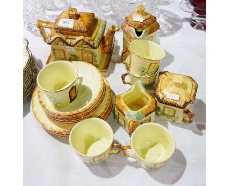 A quantity of Keele St. Pottery cottageware part tea service including teapot, hot water jug and jug, lidded sucrier, etc. 