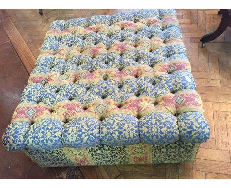 Large buttoned upholstered pouffe on box base with casters, 120 x 107 cms 