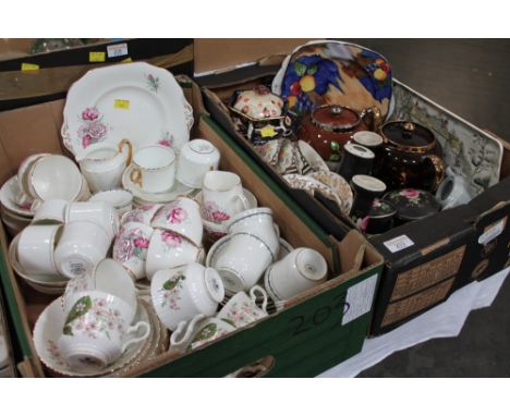 Two boxes of part tea sets, Tunstall decorative plate, teapots, black ceramic dressing table set etc