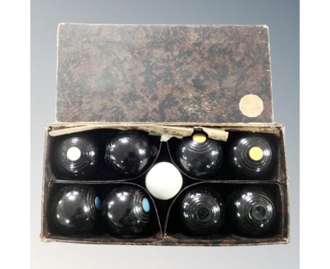 A set of vintage carpet boules, boxed.