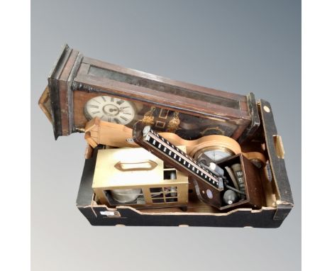 A box of vintage blood pressure cuff, barometer and wall clock 