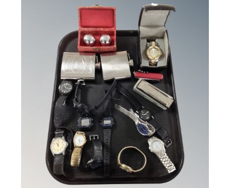 A tray containing hip flasks, Chinese medicine balls in box, gent's wristwatches including Casio, Sekonda etc.