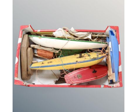 A box of three vintage wooden pond yachts 