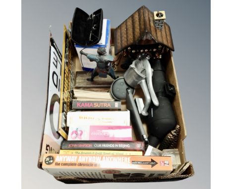 A box of miscellany to include Maginon spotting scope, books, contemporary tin signs, black forest style cuckoo clock etc 