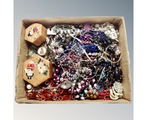 A box containing wooden Oriental style trinket boxes together with a large quantity of costume jewellery.