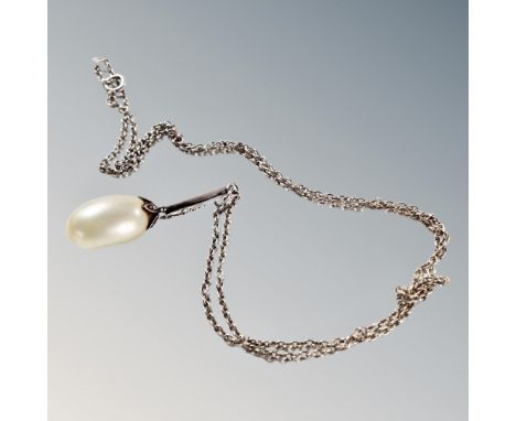 A Baroque teardrop pearl in an Art Deco setting on sterling silver chain, 7.9g gross.