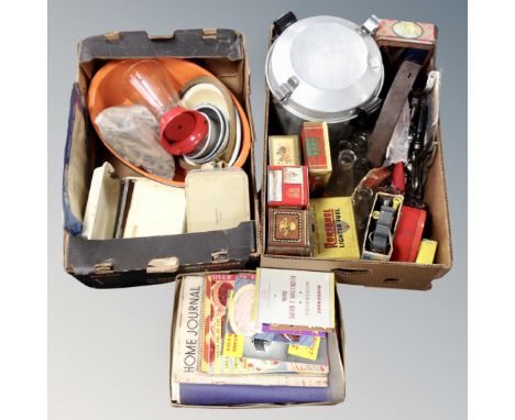 Three boxes containing vintage kitchenalia, tins, glass bottles, recipe books etc.