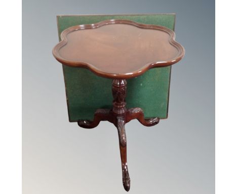 A Victorian style shaped mahogany pedestal wine table on claw and ball feet together with a 20th century baize topped folding