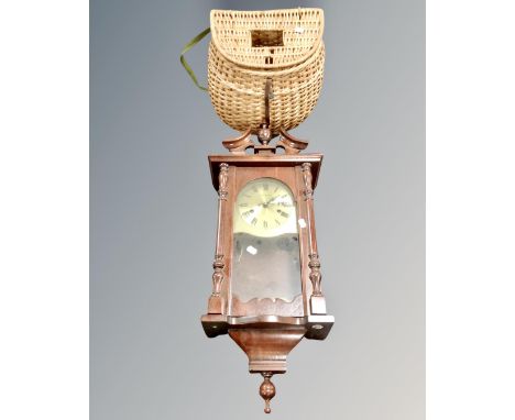 A C Wood &amp; Son eight day wall clock together with a vintage fishing creel.