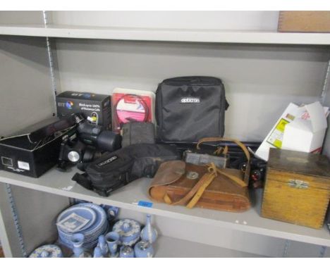 A mixed lot to include a Kodak camera, a Mighty Midget Travel Scope, binoculars and other items 